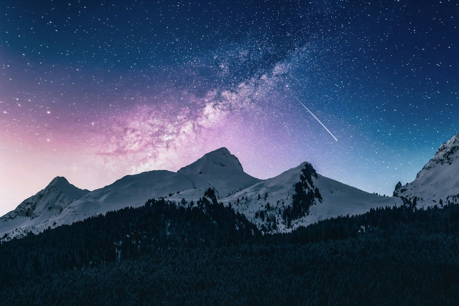 Milky Way over snowy mountains